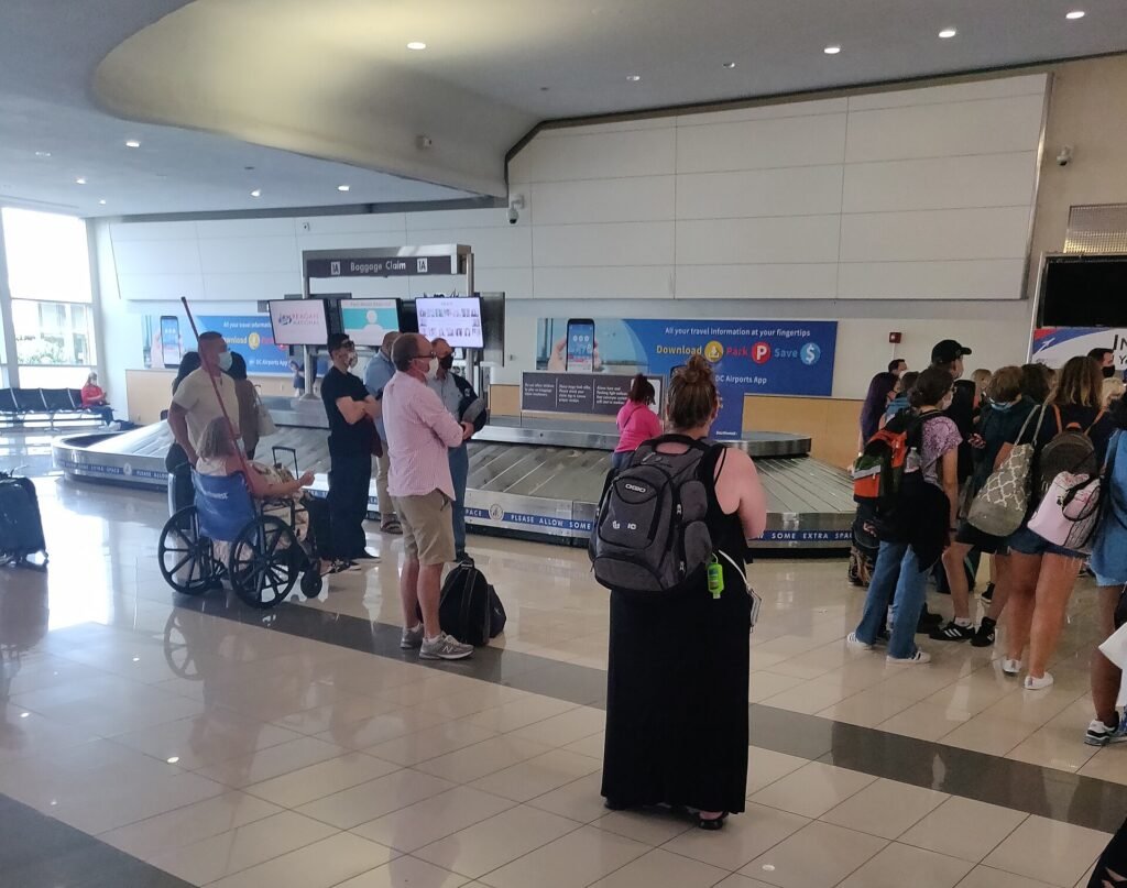 Airport baggage claim area with luggage carousel